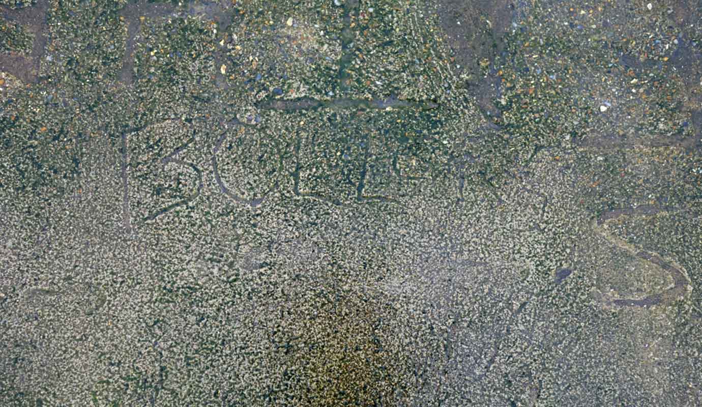 Wet cement 'graffiti' on Walcott sea defences Norfolk